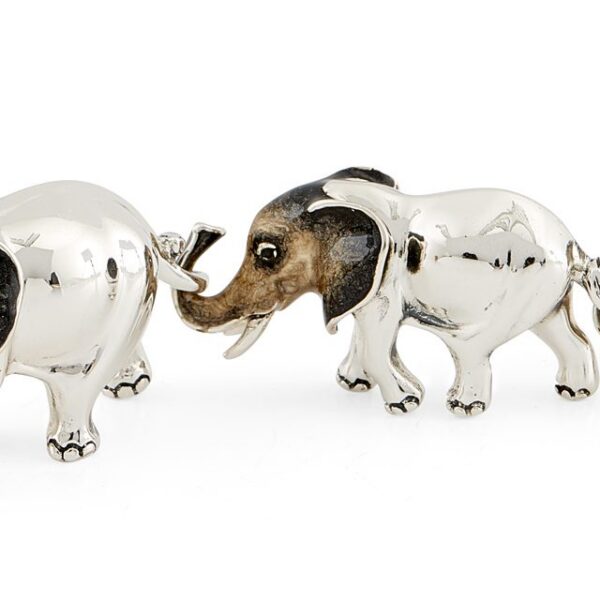 Three Linked Elephants With Grey Enamel Heads