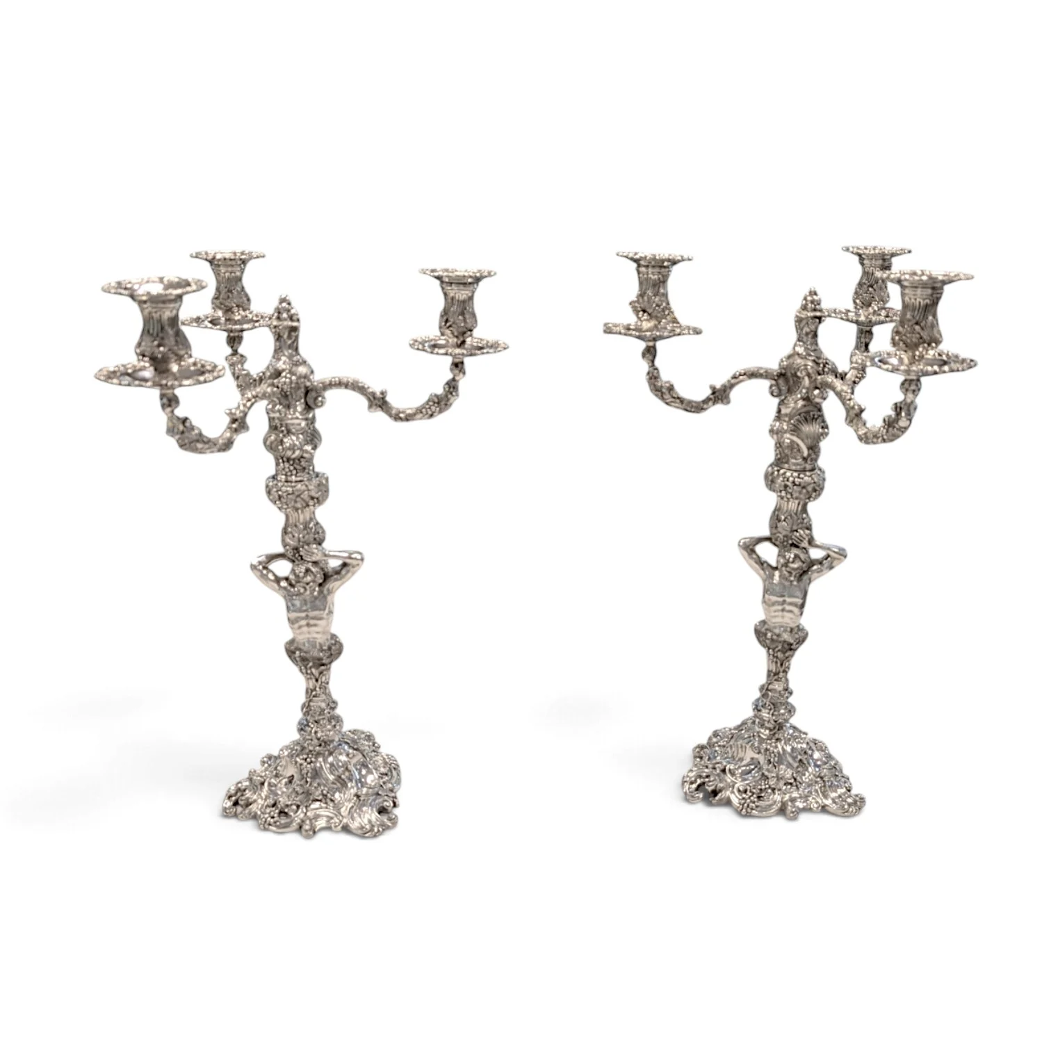 Pair of silver three-light candelabra with figural stems and rococo scroll bases
