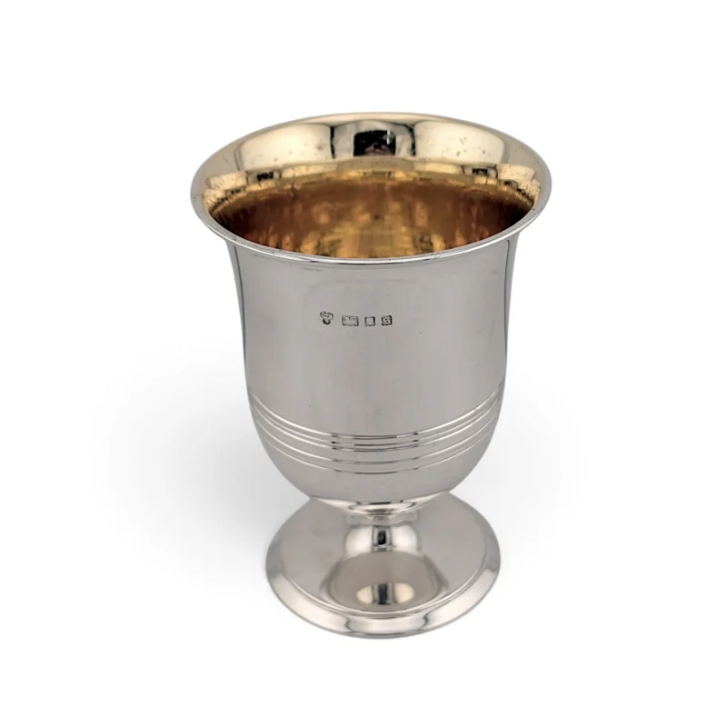 Silver cup on a pedestal foot with reeded bands and gilt interior, London 1933