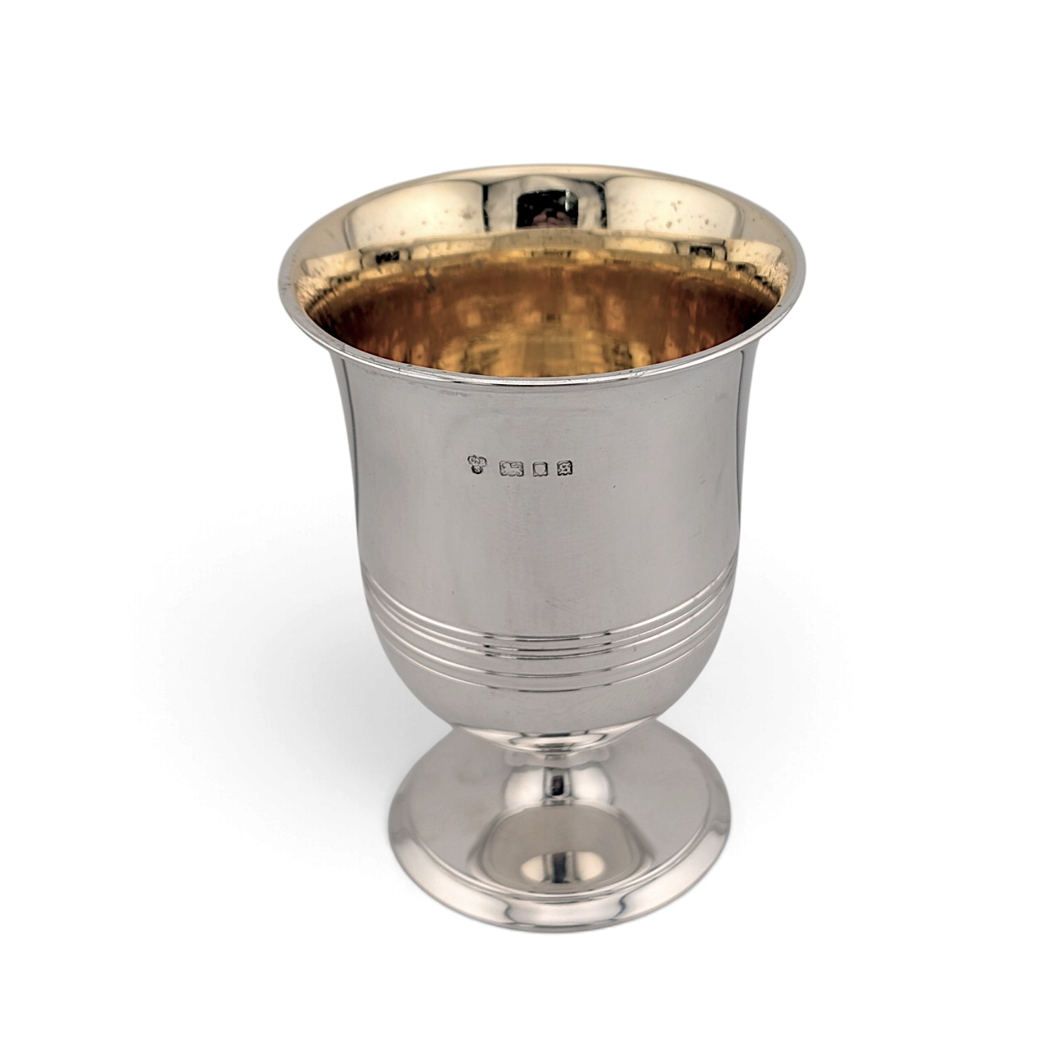 Silver cup on a pedestal foot with reeded bands and gilt interior, London 1933