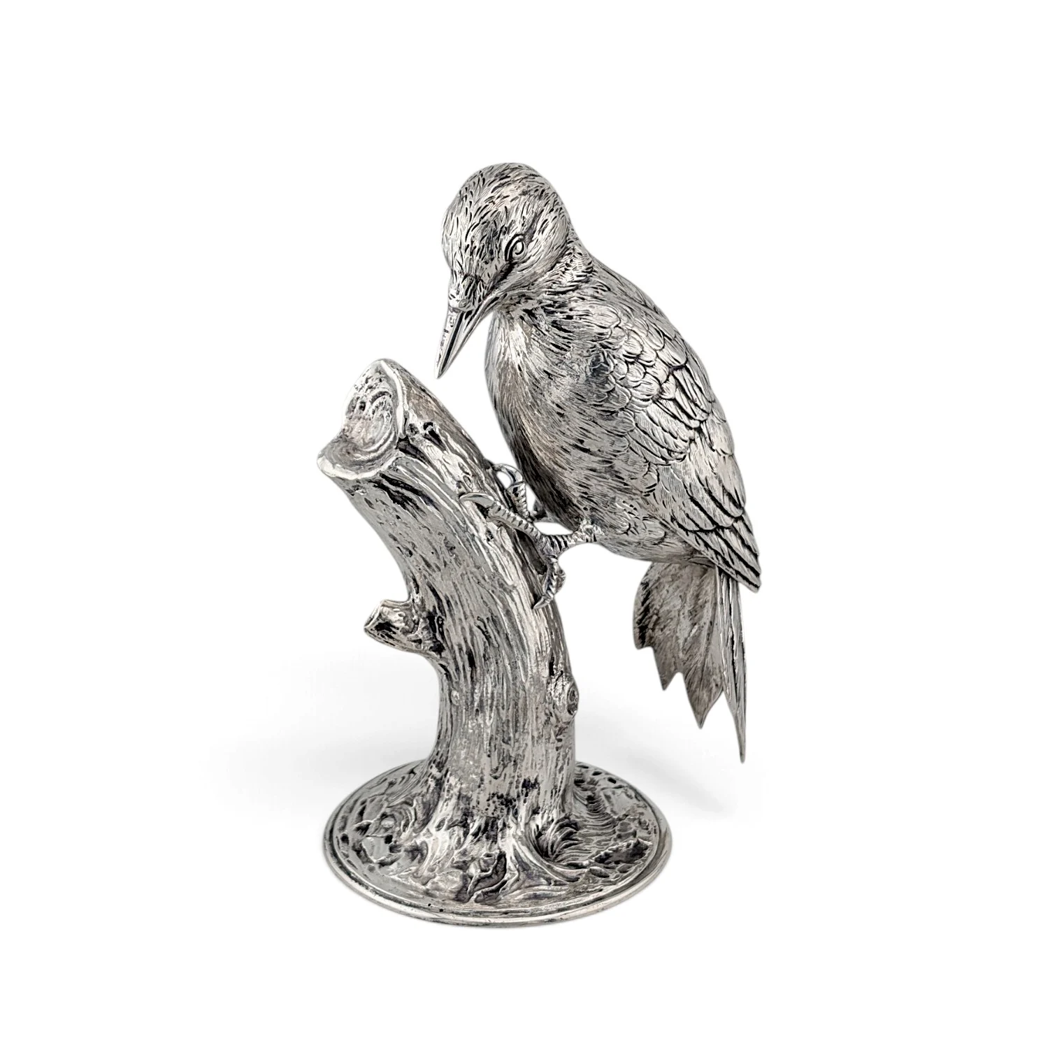 Silver woodpecker figure perched on a tree-stump base