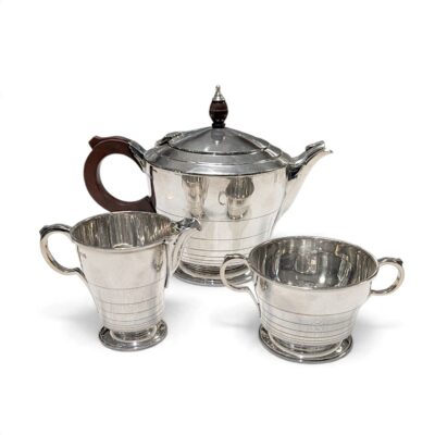 Art Deco silver three-piece tea set: teapot, milk jug and sugar bowl