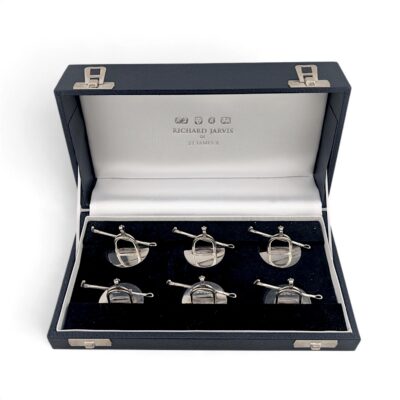 Six silver stirrup menu holders in a Richard Jarvis presentation case