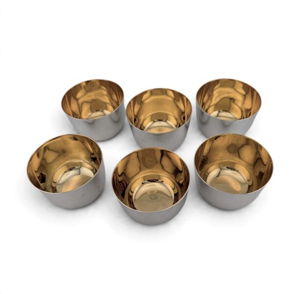 Six tumbler cups from above, showing the gilded interiors