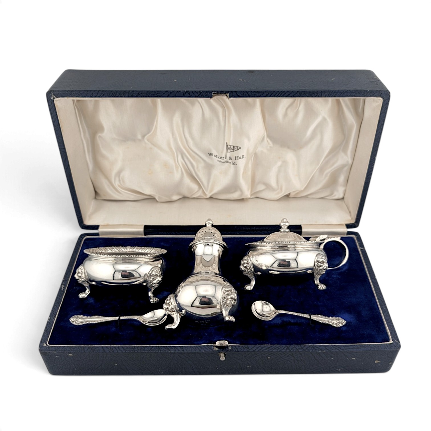 Silver condiment set of salt, pepper and mustard with spoons in a fitted case