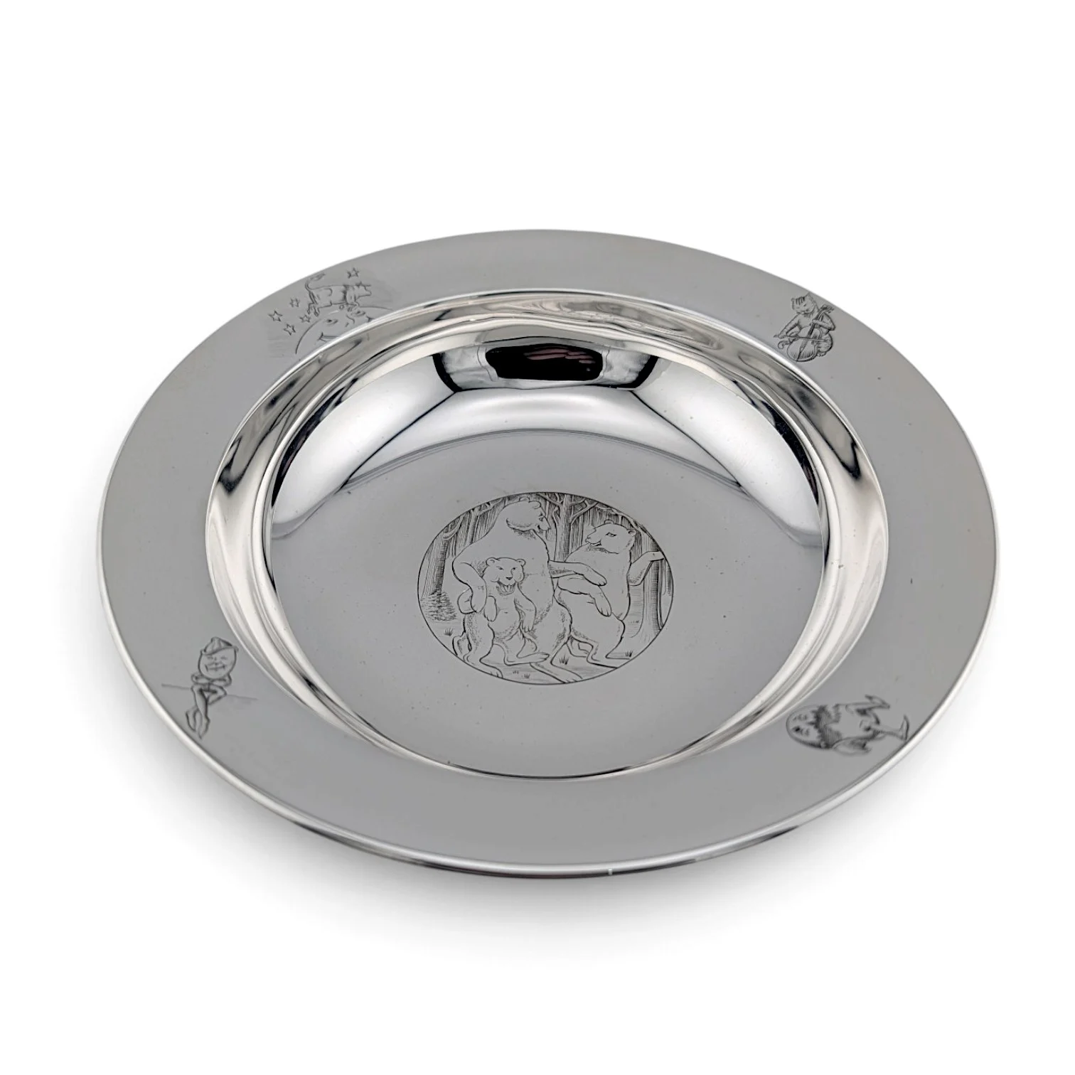 Silver christening bowl with a broad rim and an engraved bear scene in the centre
