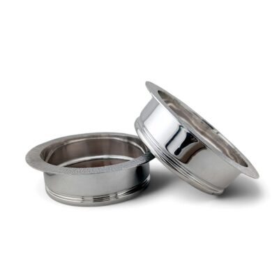 Pair of silver ship's coasters, one tilted to show the wooden base