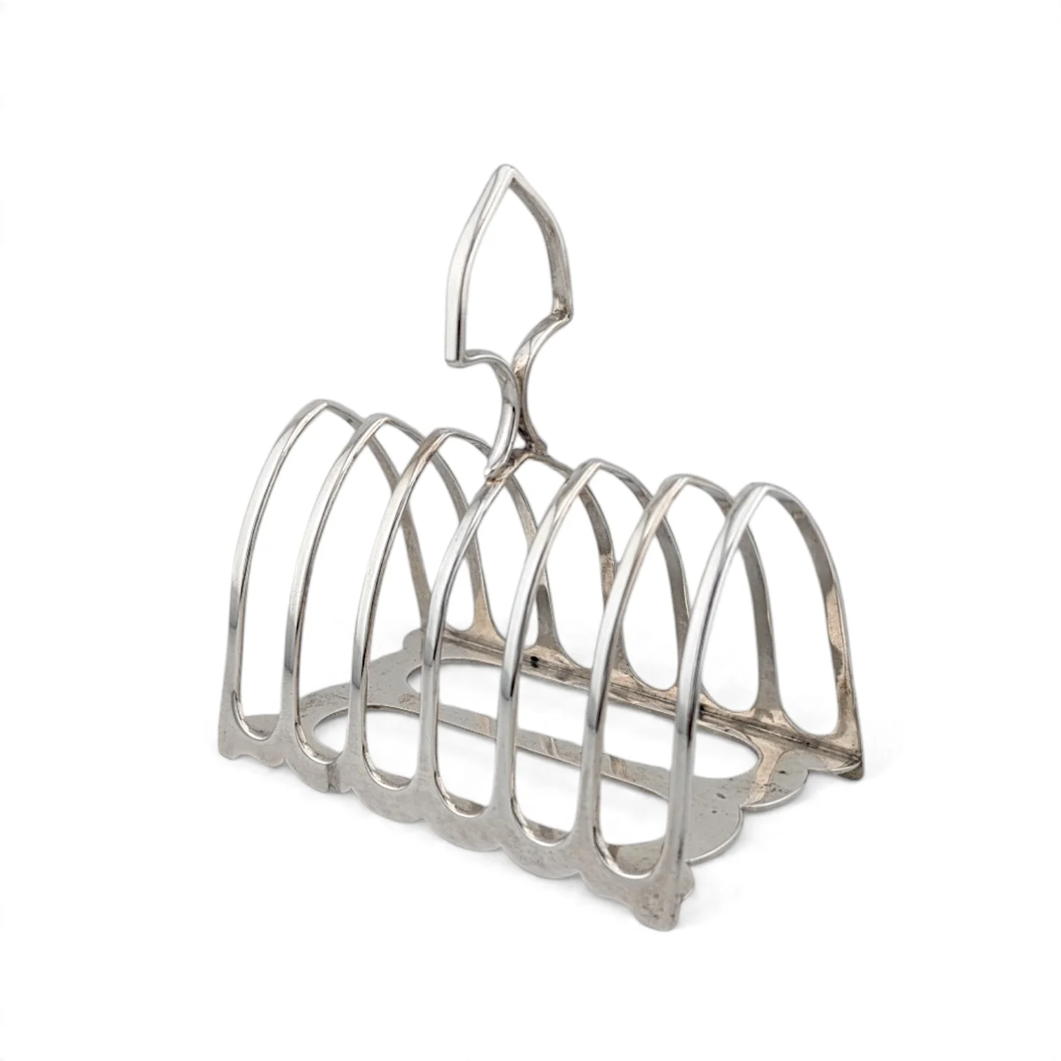Silver toast rack with arched bars and a central handle
