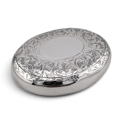 Oval silver tobacco box with an engraved scrolling lid