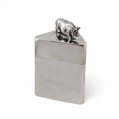 Triangular silver box with a pig finial on the lid