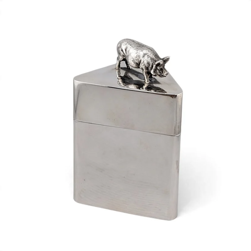 Triangular silver box with a pig finial on the lid